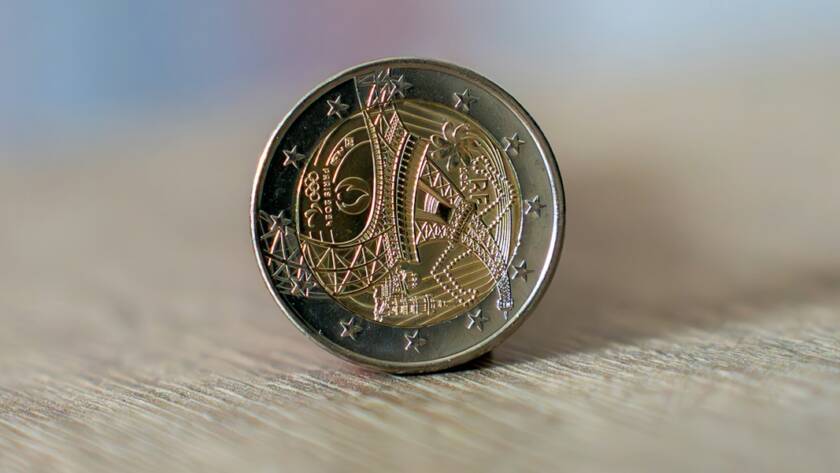 a close up of a coin on a wall